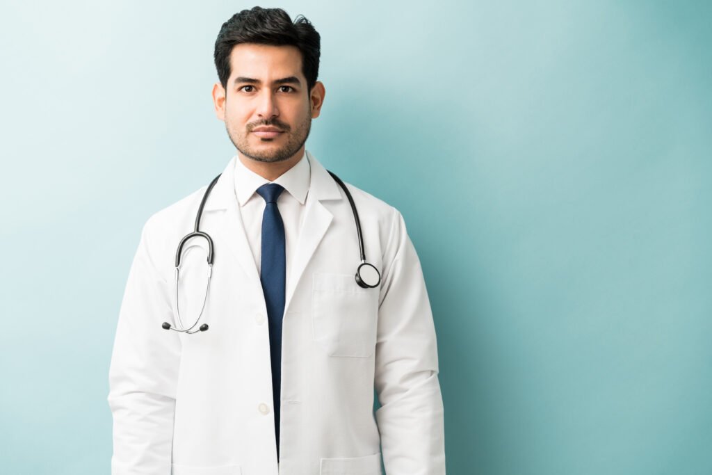 Medical Professional In Lab Coat And Stethoscope At Studio